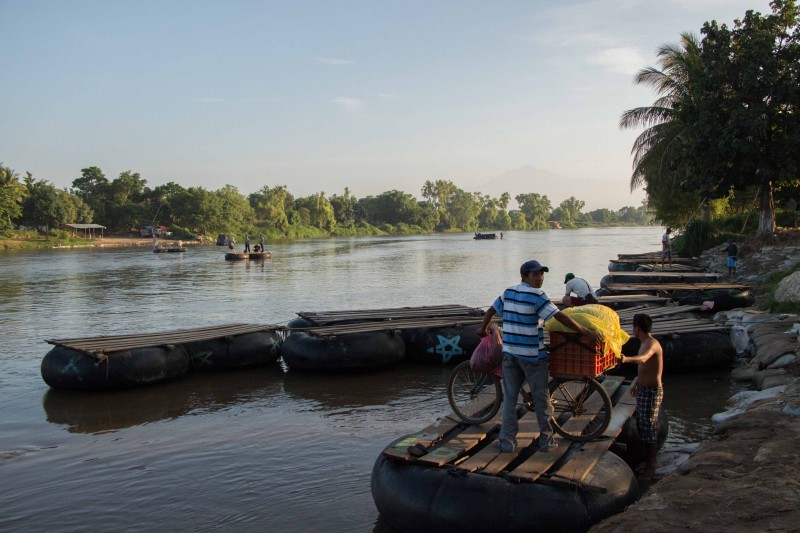 A man prepares to cross the Suchiate River into Mexico. Photo by Gabriela Bortolamedi.