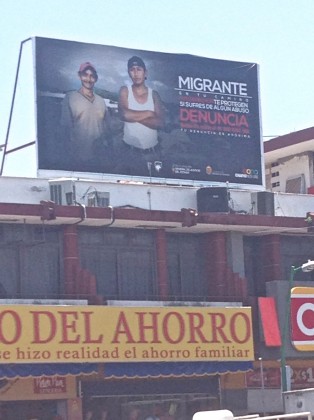 Billboard urging migrants to pursue legal action against rights violations over the central square in Tapachula